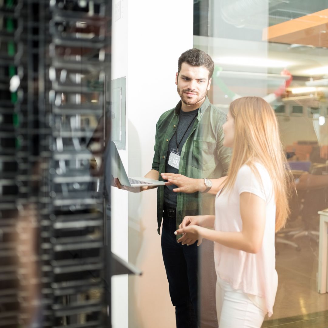 picture of people looking at a server rack